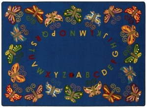 A navy blue alphabet rug with butterfly's