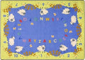 An alphabet rug with numbers and several lamb.