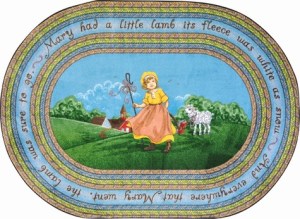 An oval children's rug with Mary and a little lamb in a field. This kids rug also contain the words to the nursery rhyme Mary had a little lamb.