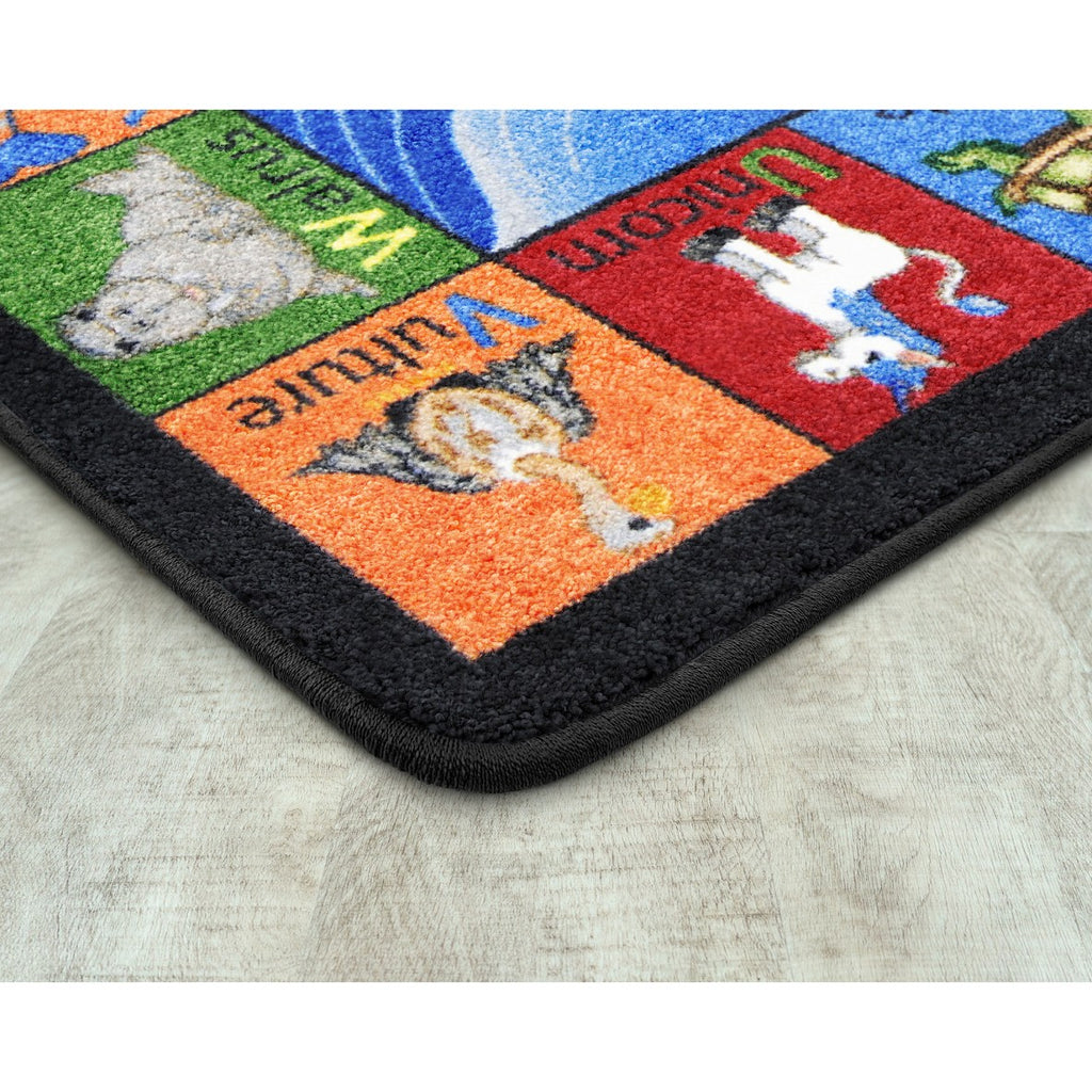 Colorful rug with animal illustrations on a wooden floor