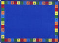 A blue child rug with alphabet in upper and lower case around the edge