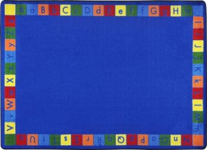 A blue child rug with alphabet in upper and lower case around the edge