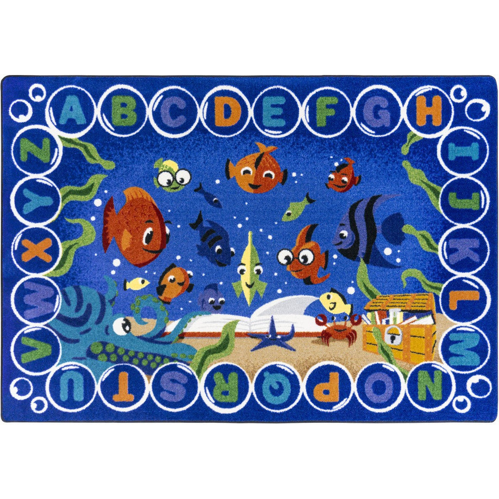 Children's rug with underwater theme, alphabet letters, and cartoon fish on a blue background.